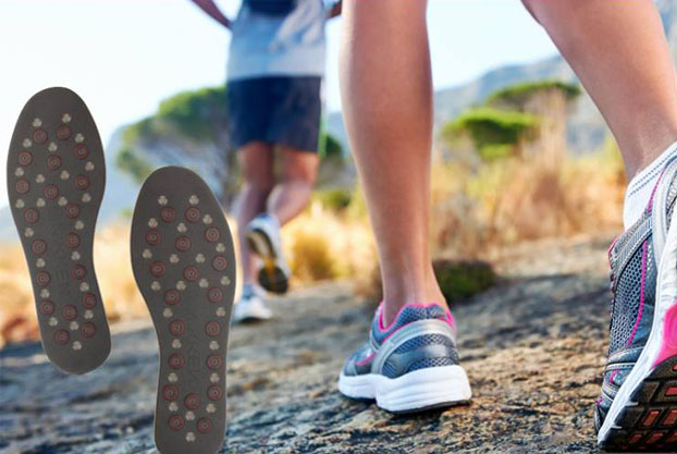 A close up of feet running and wearing sports trainers. Kenko MStride insoles are on the left of the image.